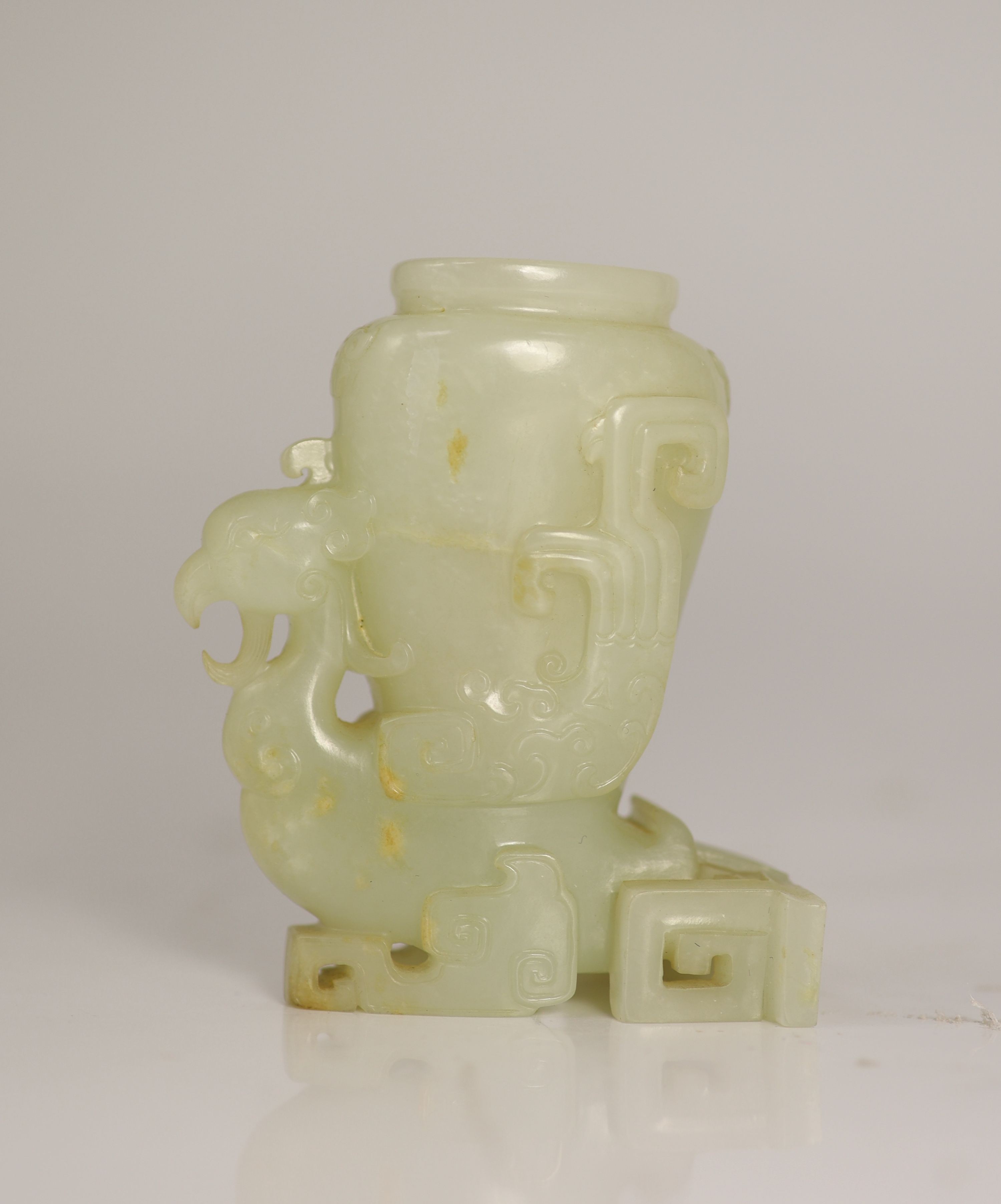 A Chinese archaistic pale celadon jade 'phoenix' vase, 18th/19th century, 8.3cm high